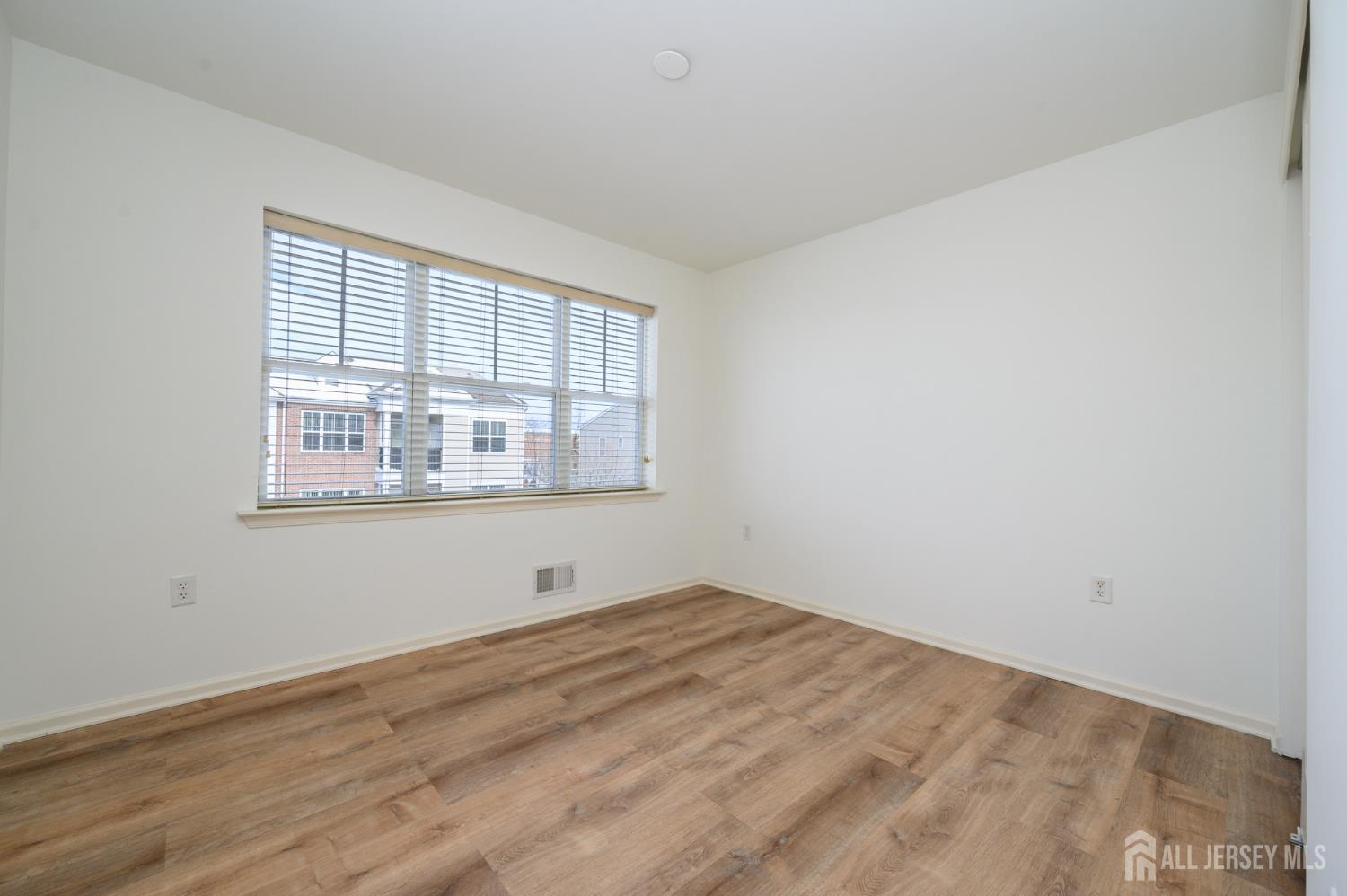 361 Lehigh Avenue Perth Amboy, NJ 08861 - Photo 18 of 28 a view of empty room with wooden floor