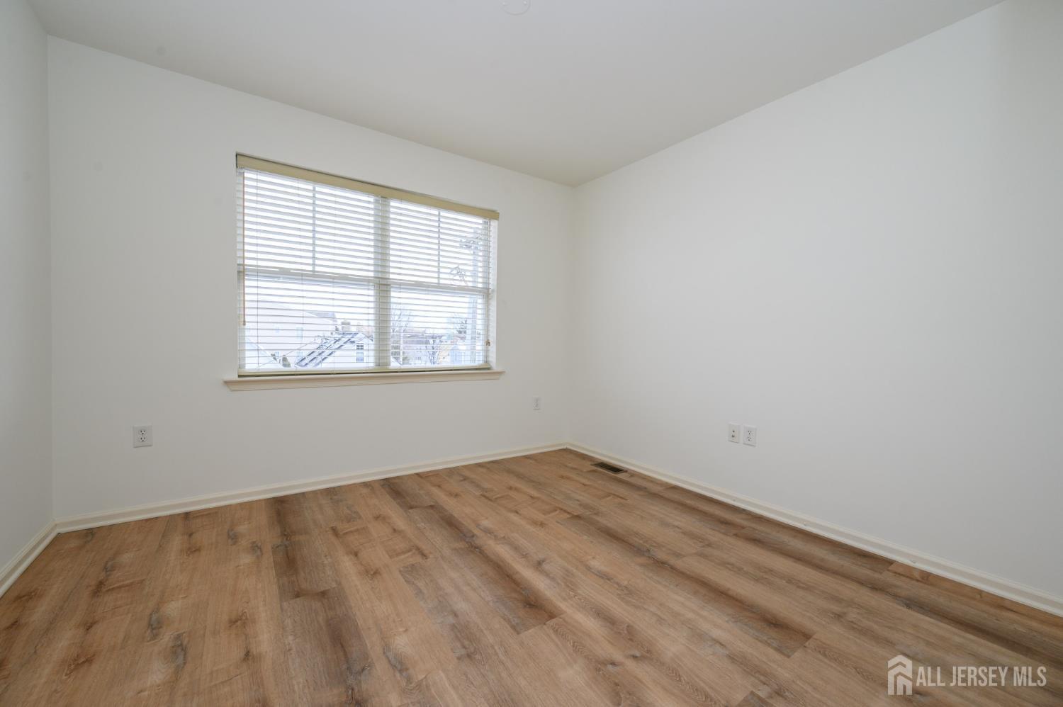 361 Lehigh Avenue Perth Amboy, NJ 08861 - Photo 21 of 28 an empty room with a window