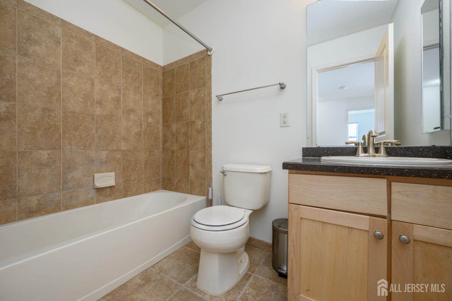 361 Lehigh Avenue Perth Amboy, NJ 08861 - Photo 25 of 28 a bathroom with a sink toilet and shower