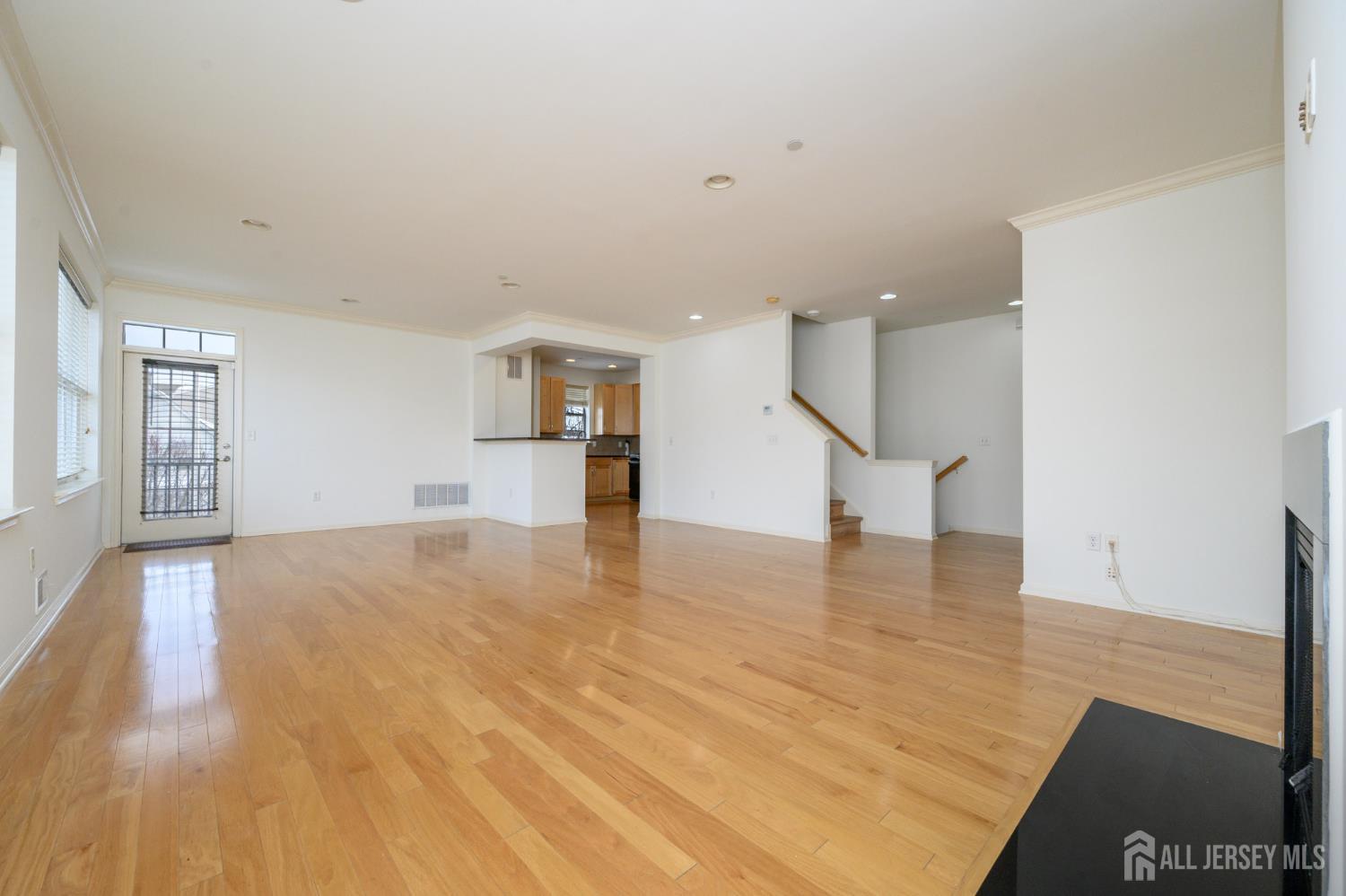 361 Lehigh Avenue Perth Amboy, NJ 08861 - Photo 5 of 28 a view of empty room with wooden floor