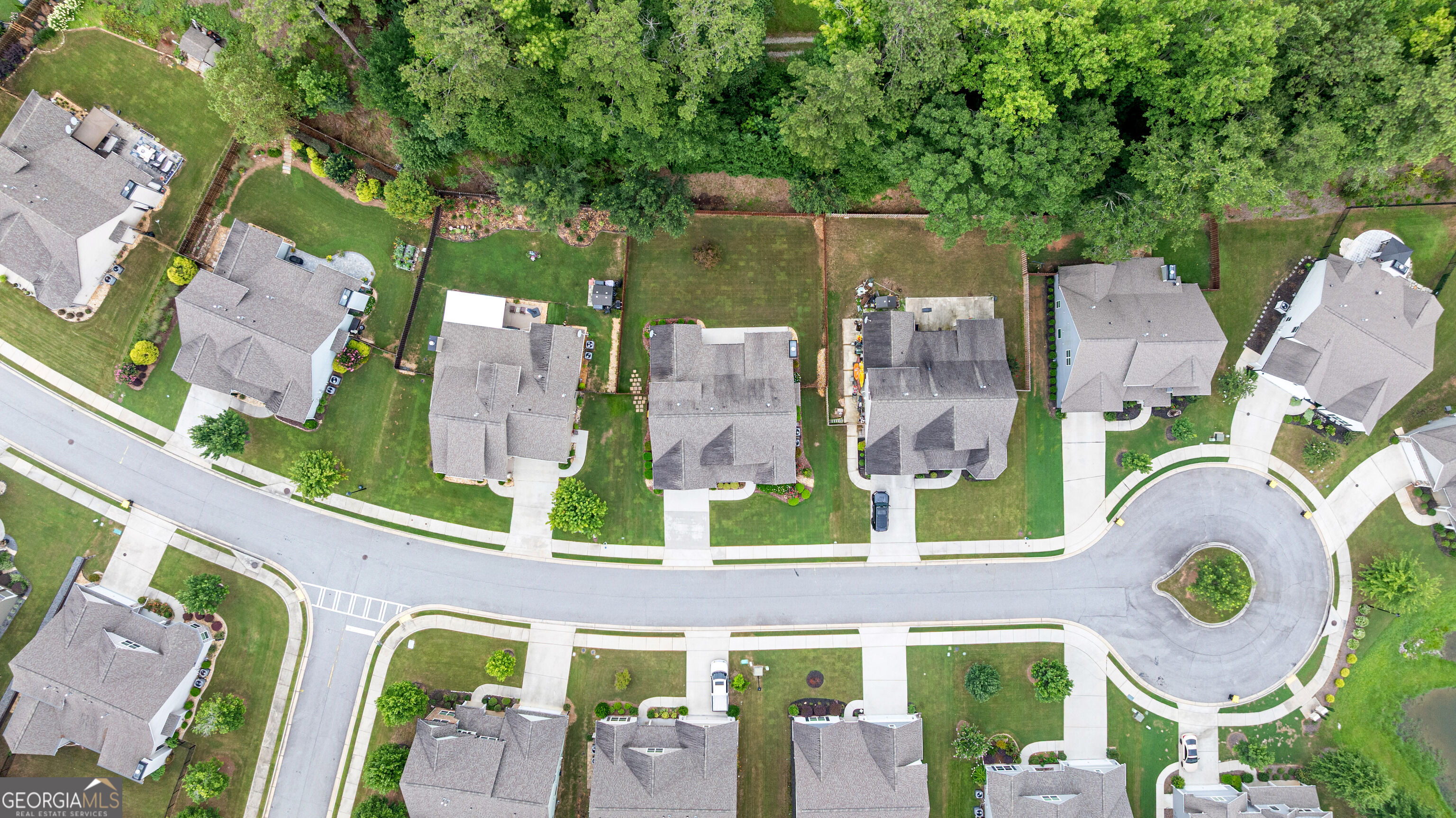 12 Delaware Way Newnan, GA 30265 - Photo 56 of 61 Aerial neighborhood view showing tree-lined streets and nearby homes.