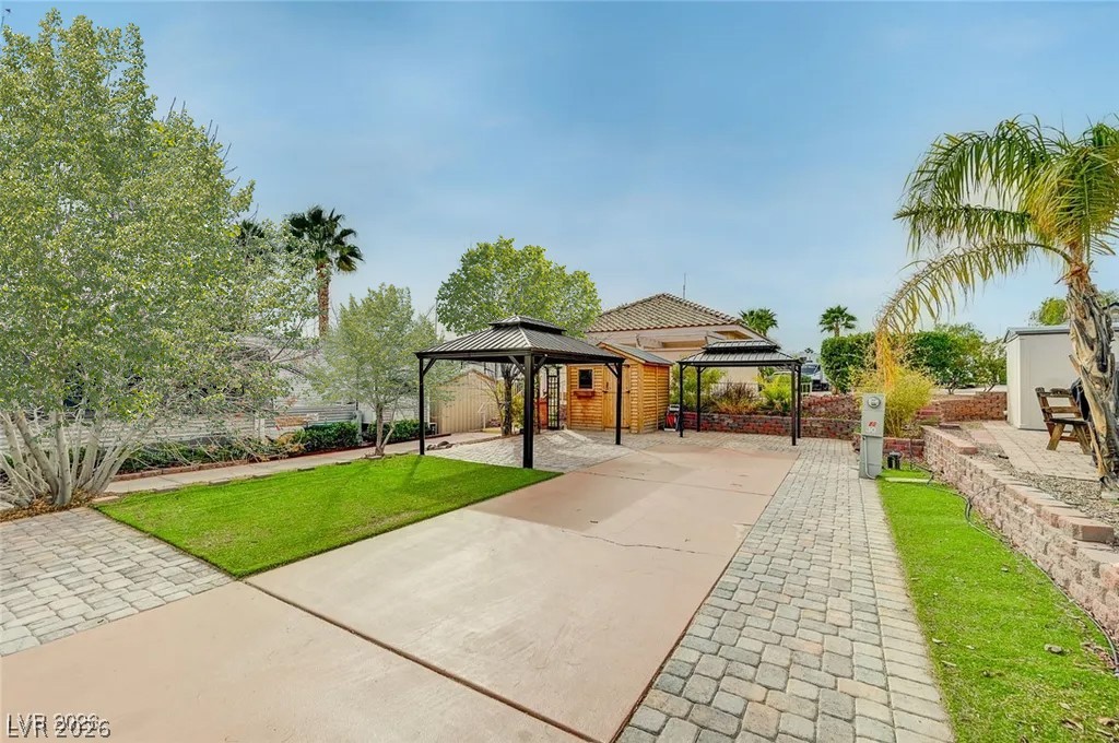 866 Sparrow Way Boulder City, NV 89005 - Photo 1 of 25 Fenced backyard with a gazebo and a patio