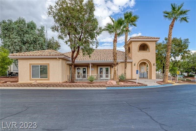 866 Sparrow Way Boulder City, NV 89005 - Photo 23 of 25 Mediterranean / spanish house with stucco siding, a tile roof, and french doors