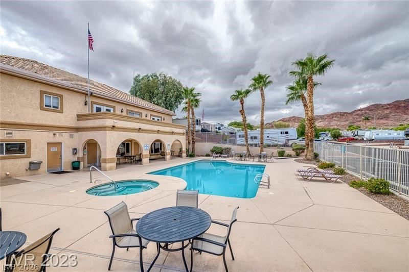 866 Sparrow Way Boulder City, NV 89005 - Photo 24 of 25 Community pool with a patio, a community hot tub, and outdoor dining area