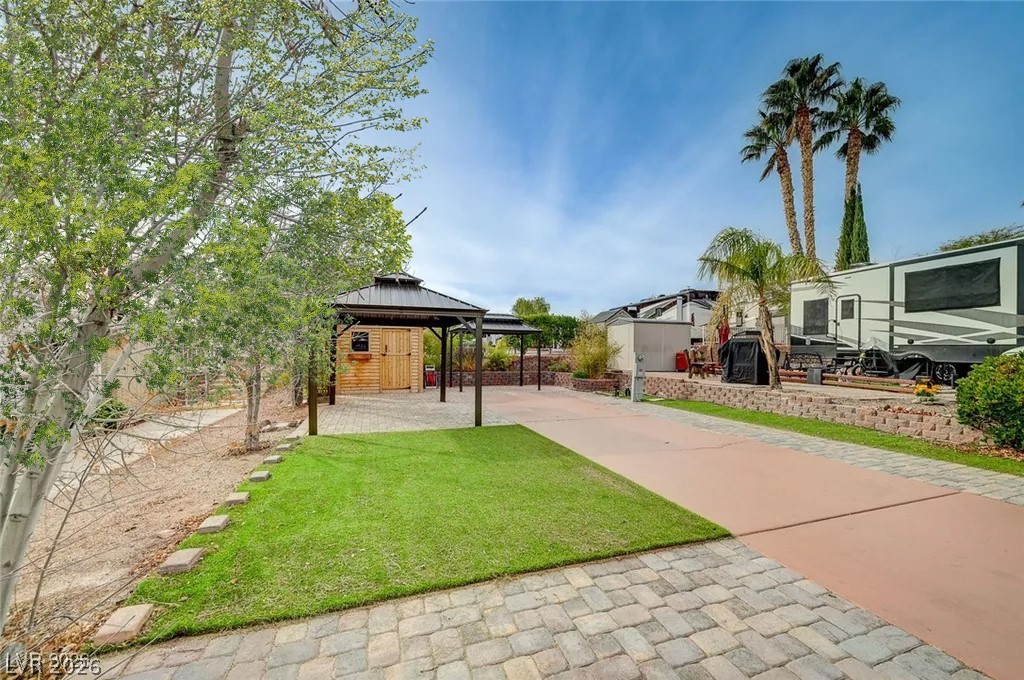 866 Sparrow Way Boulder City, NV 89005 - Photo 4 of 25 View of grassy yard with a gazebo and a patio