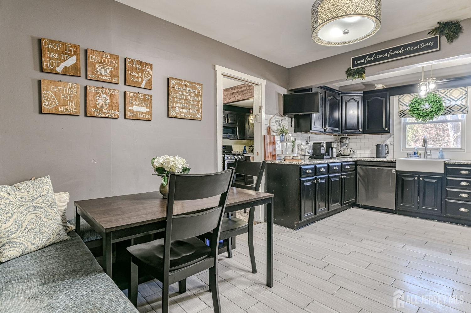 52 Owens Road Old Bridge, NJ 08857 - Photo 14 of 39 a kitchen with cabinets and chairs in it