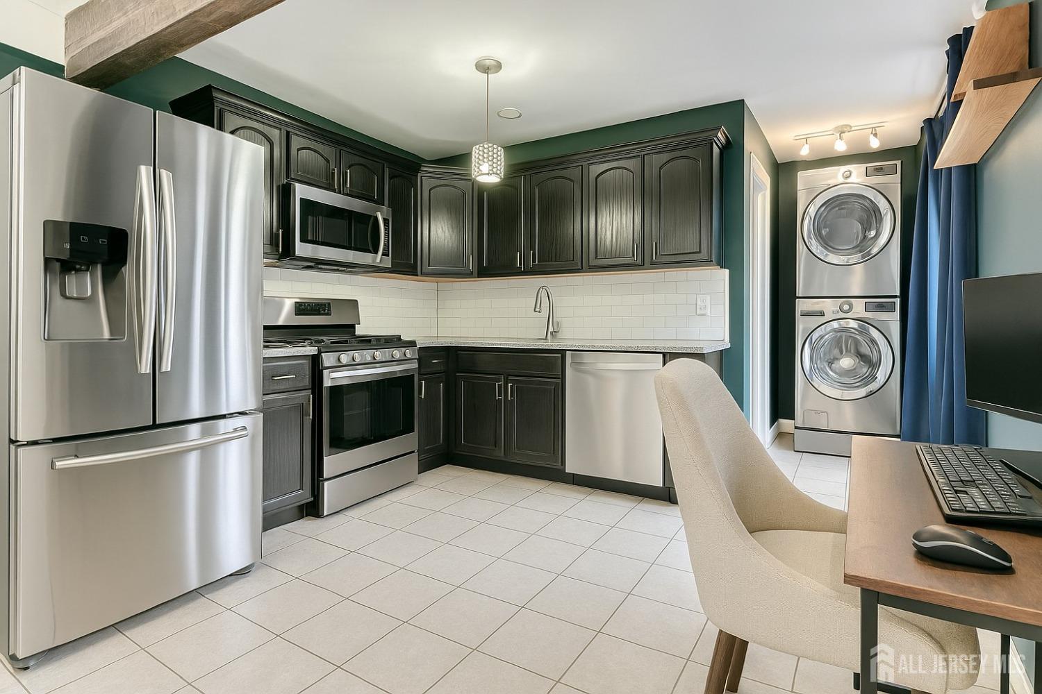 52 Owens Road Old Bridge, NJ 08857 - Photo 21 of 39 a kitchen with stainless steel appliances a stove microwave and refrigerator