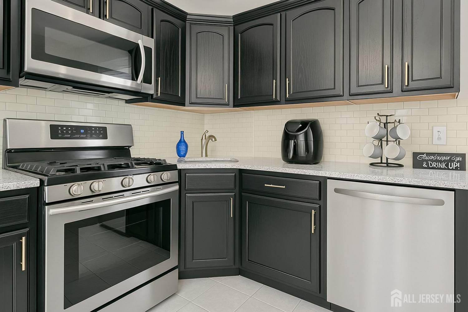 52 Owens Road Old Bridge, NJ 08857 - Photo 22 of 39 a kitchen with stainless steel appliances granite countertop a stove microwave and sink