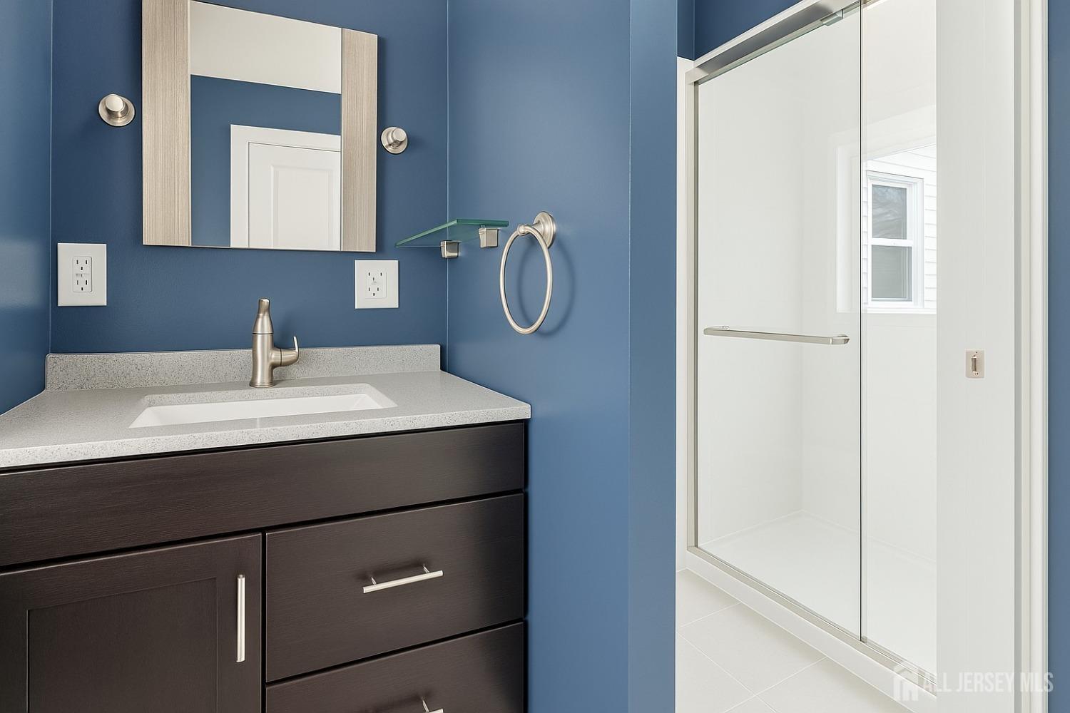 52 Owens Road Old Bridge, NJ 08857 - Photo 23 of 39 a bathroom with a sink and mirror
