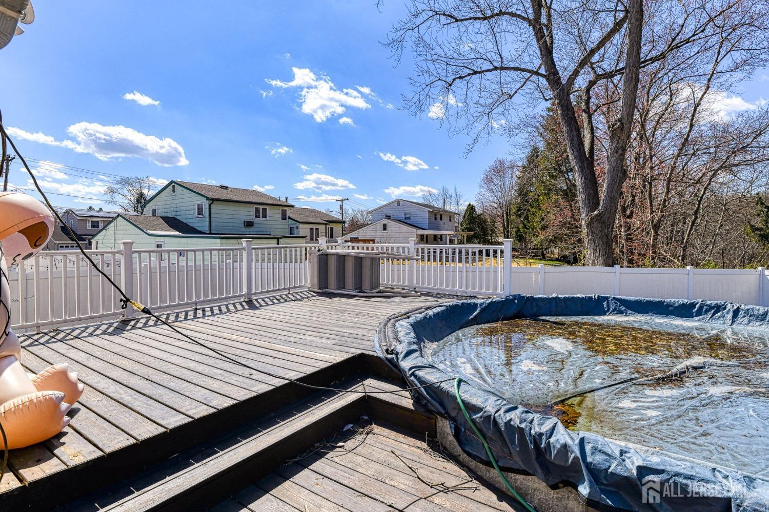 52 Owens Road Old Bridge, NJ 08857 - Photo 32 of 39 a view of a roof deck with wooden floor and fence