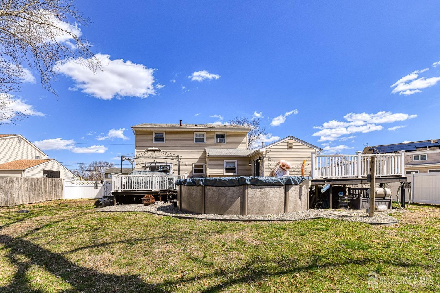 52 Owens Road Old Bridge, NJ 08857 - Photo 34 of 39 a view of a kitchen with kitchen island a counter top space a sink and appliances