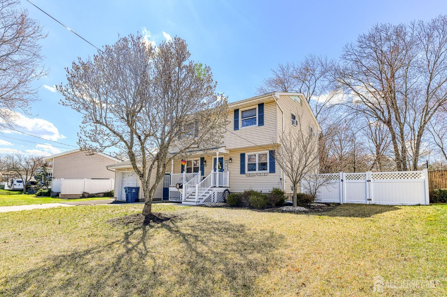 52 Owens Road Old Bridge, NJ 08857 - Photo 39 of 39 a front view of house with yard and trees in the background