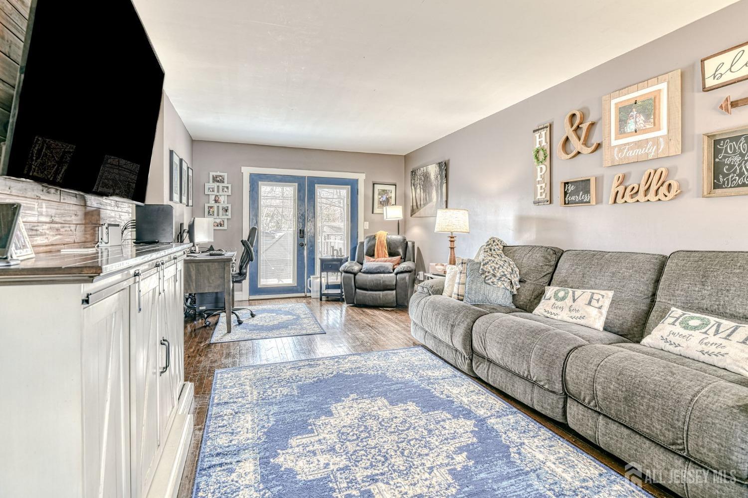 52 Owens Road Old Bridge, NJ 08857 - Photo 5 of 39 a living room with furniture and a flat screen tv