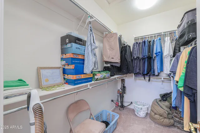 a kitchen with stainless steel appliances a sink and a refrigerator
