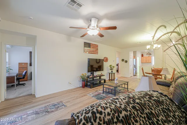 a bedroom with furniture and a wooden floor