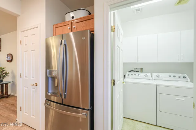 a view of bathroom with a sink and mirror