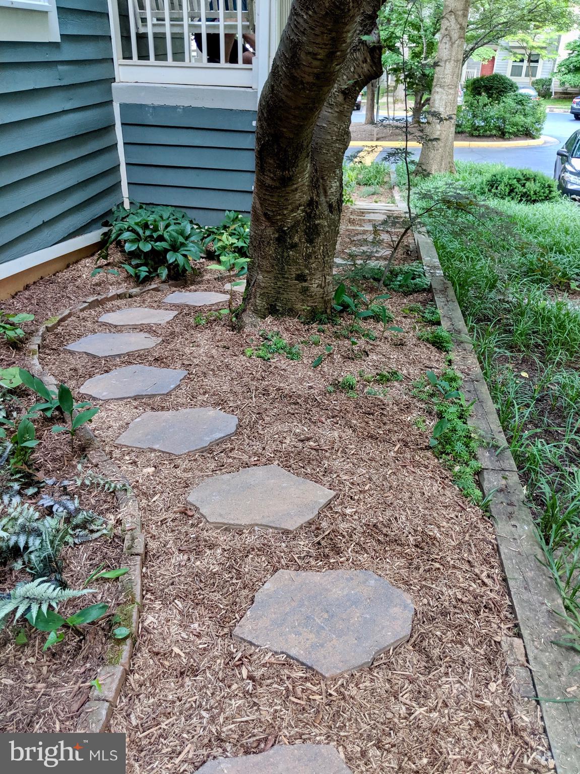 1635 Oak Spring Way Reston, VA 20190 - Photo 8 of 33 WALKWAY AROUND THE SIDE OF THE HOME TO REAR YARD