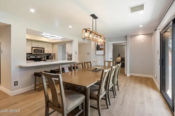 a view of a dining room with furniture window and outside view