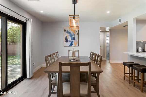 a bed room with a bed and a chandelier