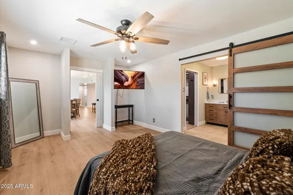 a bathroom with a sink vanity and mirror