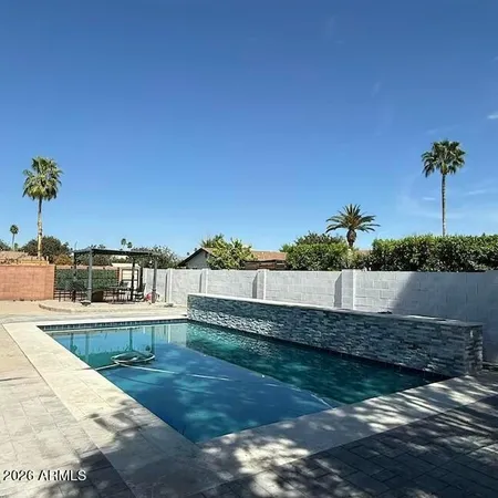 a front view of a house with sitting area