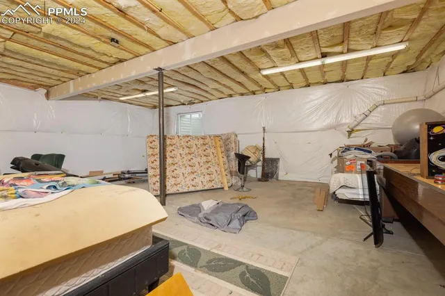 a view of a storage room with furniture