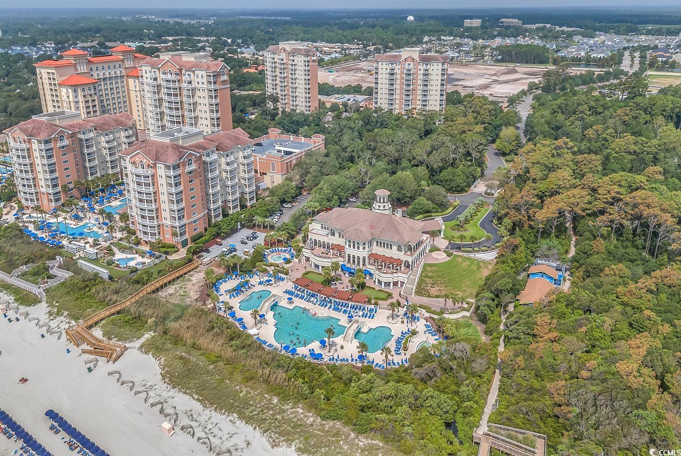 8488 Cape Dutch Loop Myrtle Beach, SC 29572 - Photo 23 of 29 Aerial view of property and surrounding area featuring a pool area and nearby urban area