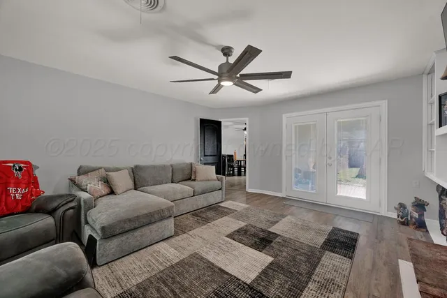 a living room with furniture and a window