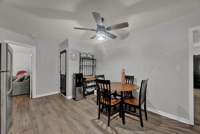 a view of a dining room with furniture and wooden floor