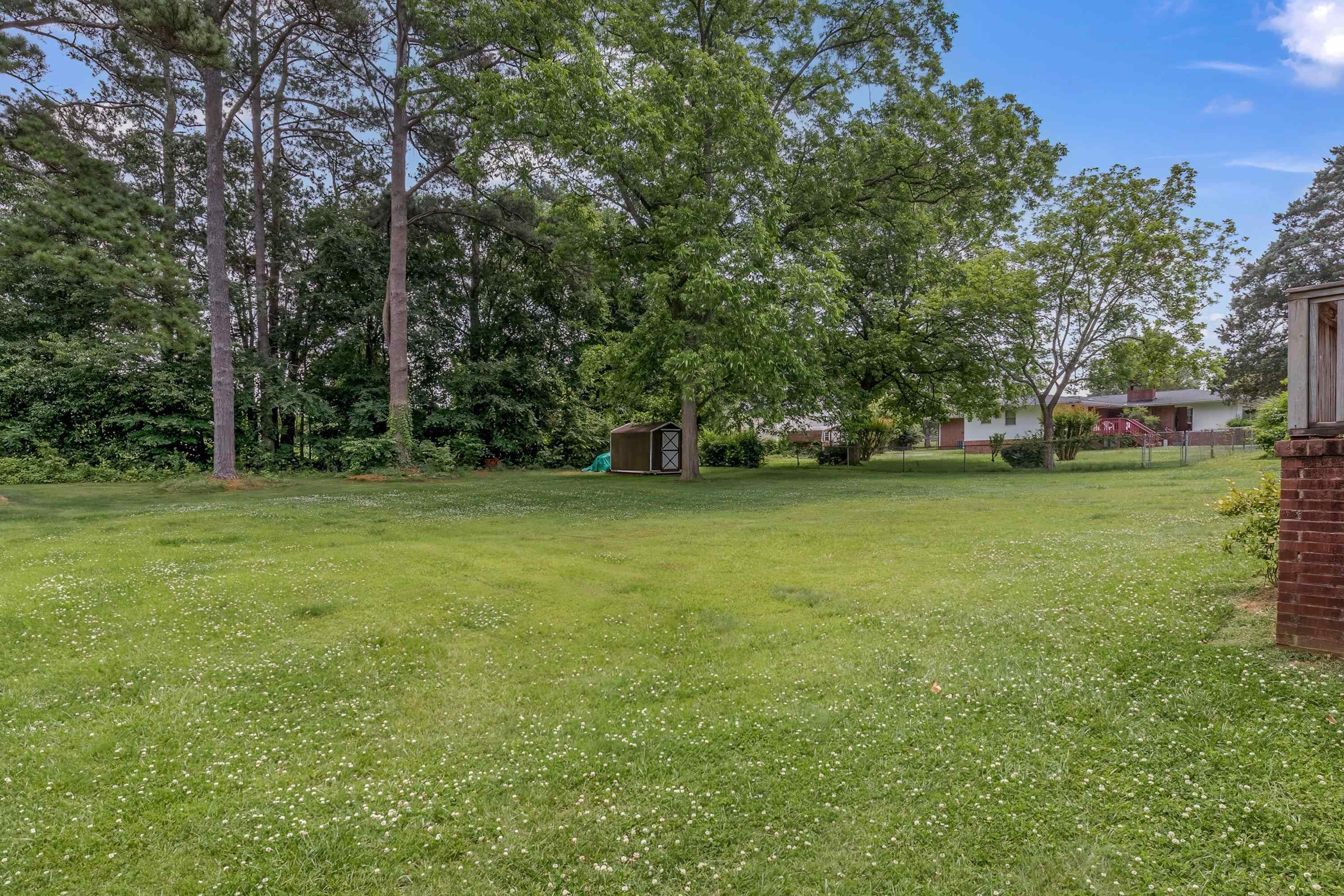 2405 Brenda Drive Raleigh, NC 27610 - Photo 26 of 27 a view of a field with a trees