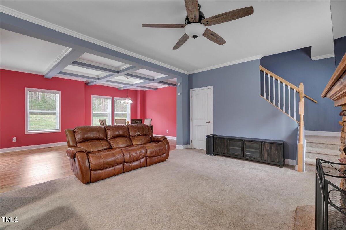 90 Ferncrest Court Roxboro, NC 27574 - Photo 13 of 45 a living room with furniture a ceiling fan and a window