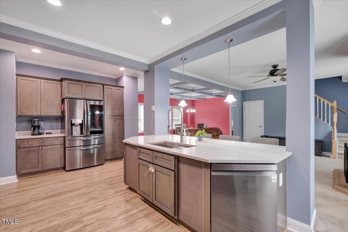 90 Ferncrest Court Roxboro, NC 27574 - Photo 18 of 45 a kitchen with stainless steel appliances granite countertop a sink and refrigerator