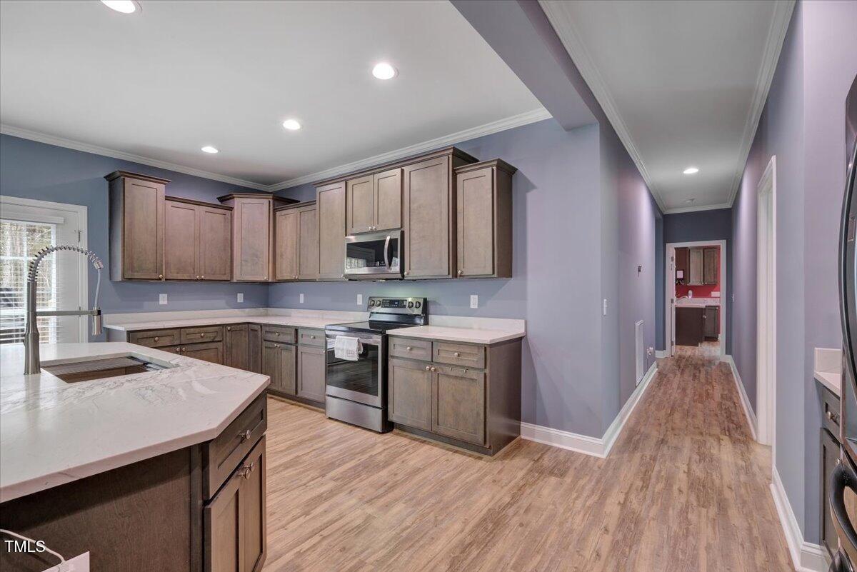 90 Ferncrest Court Roxboro, NC 27574 - Photo 20 of 45 a kitchen with a sink stove and cabinets