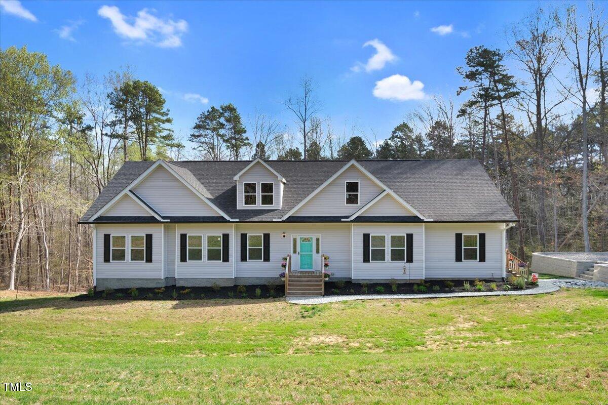 90 Ferncrest Court Roxboro, NC 27574 - Photo 2 of 45 a front view of a house with a yard outdoor seating and garage