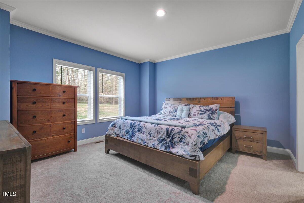 90 Ferncrest Court Roxboro, NC 27574 - Photo 22 of 45 a bedroom with a bed and a dresser