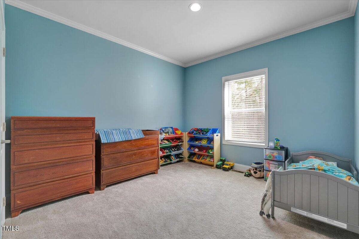 90 Ferncrest Court Roxboro, NC 27574 - Photo 30 of 45 a bedroom with furniture and a window