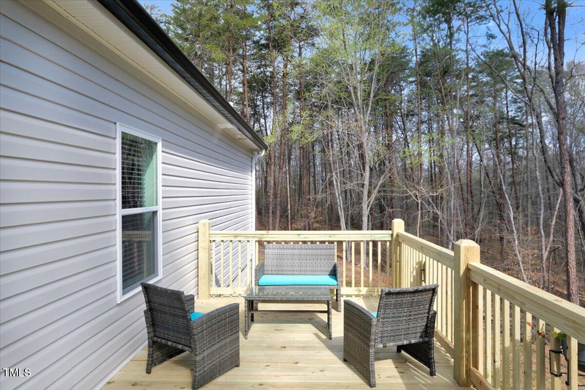 90 Ferncrest Court Roxboro, NC 27574 - Photo 36 of 45 a view of a two chairs in the balcony