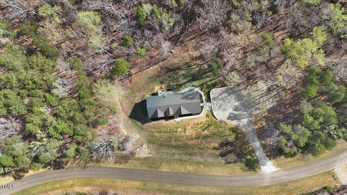 90 Ferncrest Court Roxboro, NC 27574 - Photo 42 of 45 a view of a wooden floor with a tree