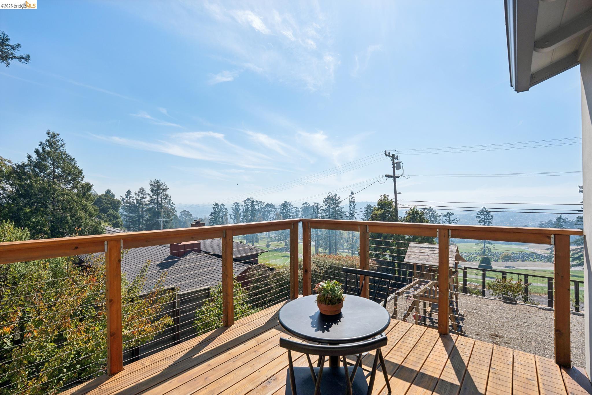 38 Highgate Road Kensington, CA 94707 - Photo 29 of 78 Wood deck with cable railing, offering open-air outdoor living