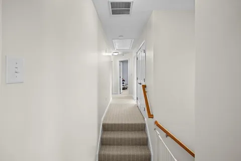 a view of a hallway with staircase