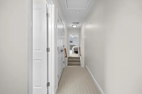 a view of a hallway with a white walls