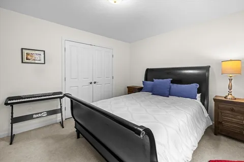 a bedroom with a bed and lamps