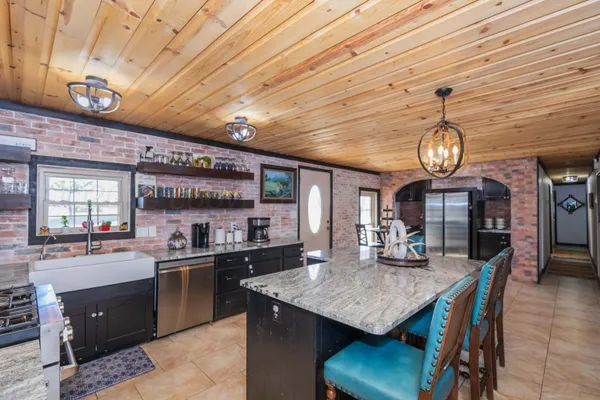 a view of a house with wooden fence