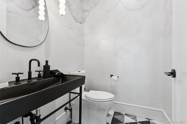 a bathroom with a sink and a toilet