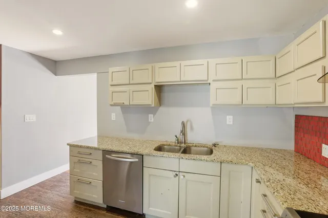 a kitchen with cabinets appliances and a counter space