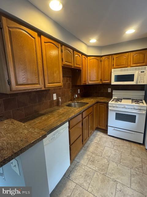 19 East Lincoln Street, Unit B Media, PA 19063 - Photo 4 of 14 a kitchen with a stove a sink and a microwave