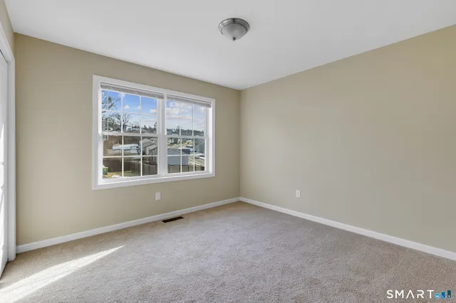 a bathroom with a granite countertop sink a toilet and bathtub