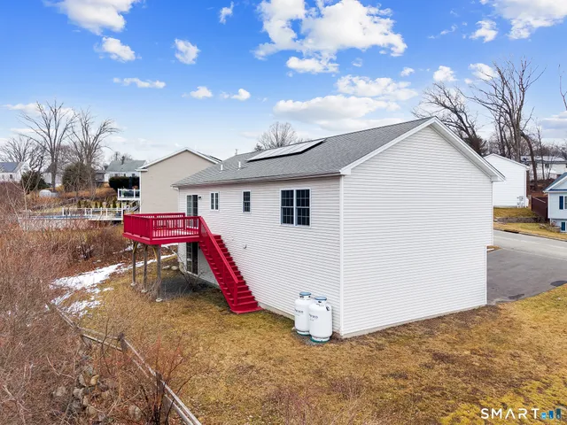 a view of a balcony with wooden floor