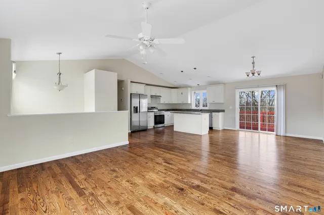 a view of kitchen with wooden floor and window