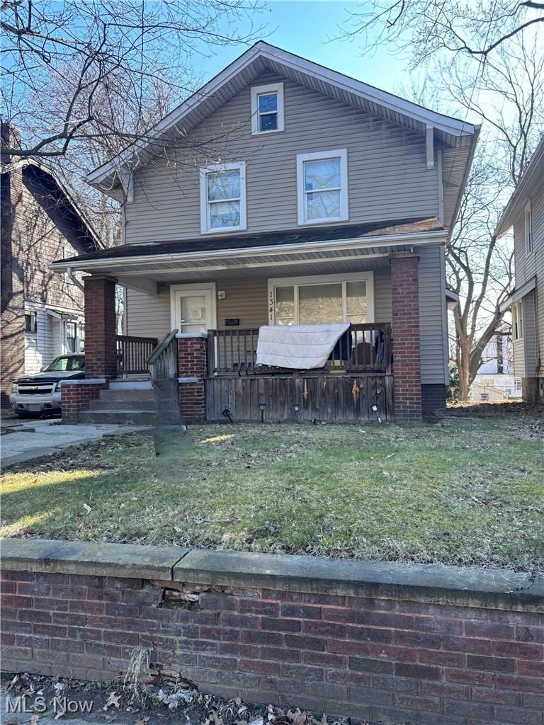 1341 Manchester Road Akron, OH 44307 - Photo 1 of 15 View of front of property featuring a porch and a front yard